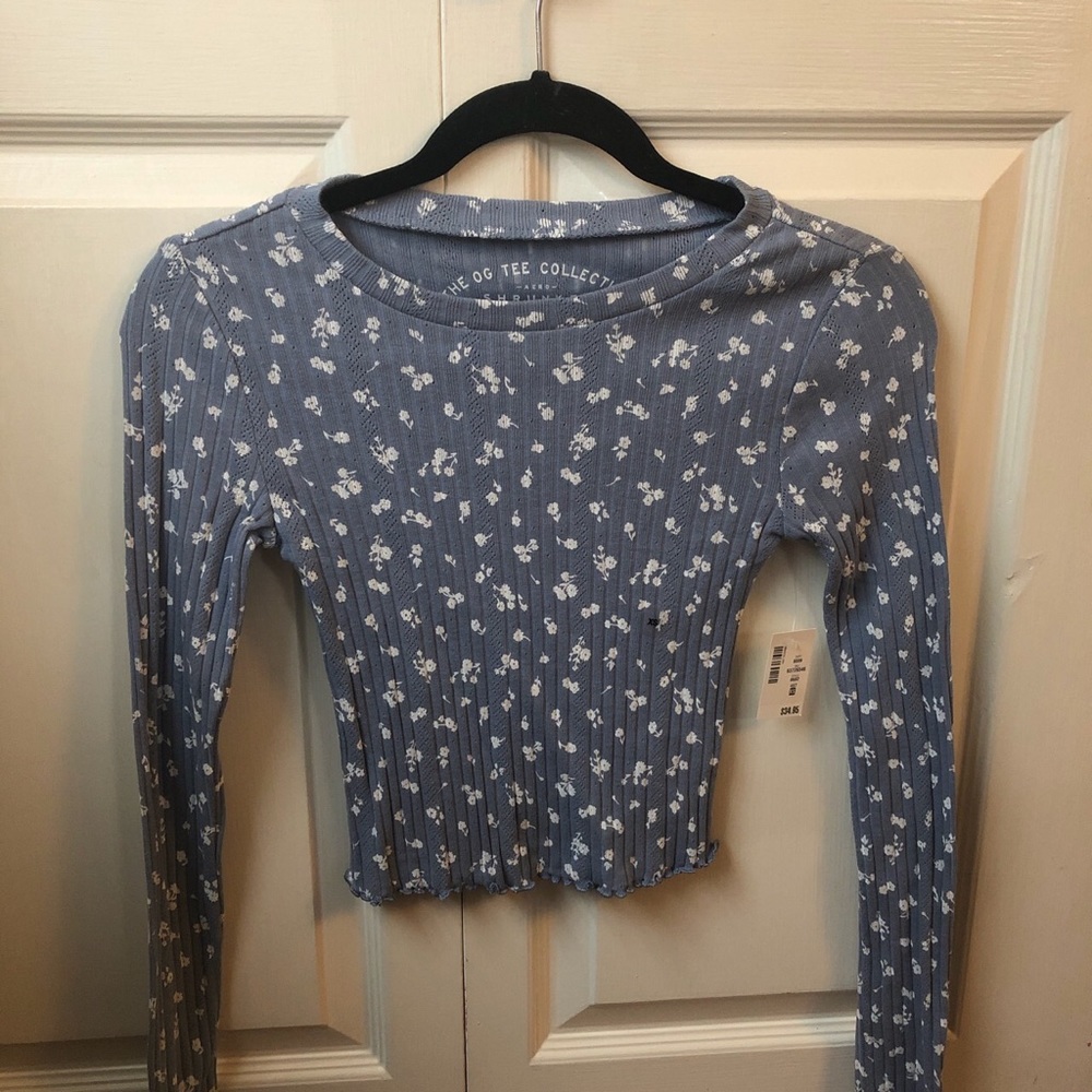 Blue long sleeve shirt with white flowers
